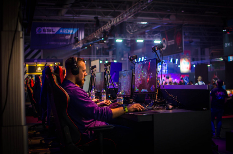 Man playing an online game on his personal computer