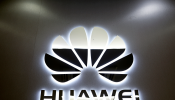 The logo of Huawei is pictured at a mobile phone shop in Singapore