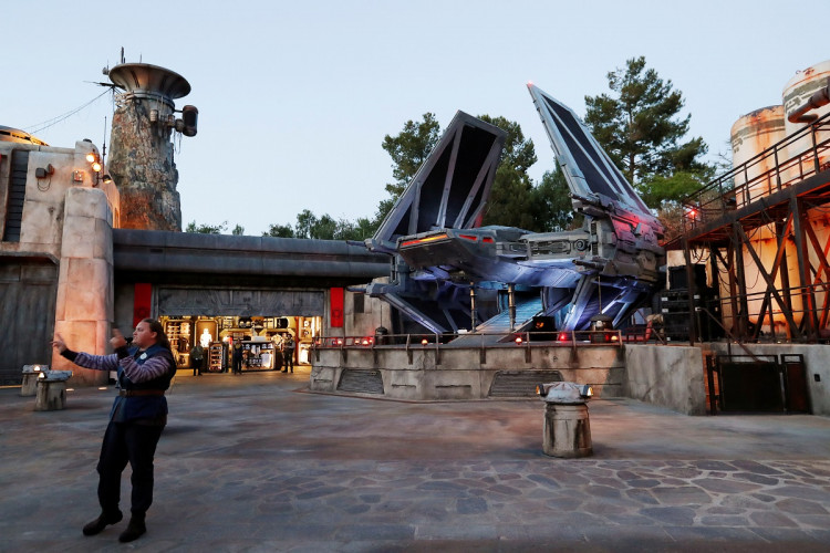 A staff member directs guests at "Star Wars: Galaxy's Edge" at Disneyland Park in Anaheim, California, U.S., May 29, 2019. 