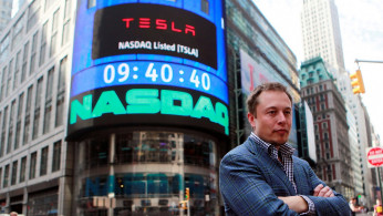 CEO of Tesla Motors Elon Musk poses during a television interview after his company's initial public offering at the NASDAQ market in New York