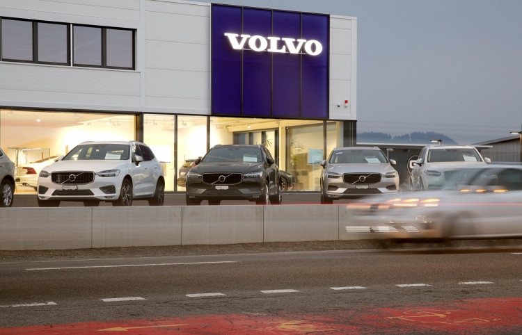 A long exposure picture shows cars of Swedish automobile manufacturer Volvo displayed in front of a showroom of Stierli Automobile AG company in St. Erhard