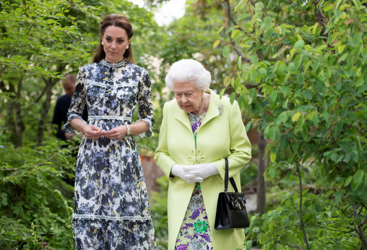 Britain's Queen Elizabeth II is shown around 'Back to Nature' by the designer, Catherine Duchess of Cambridge at the Chelsea Flower Show