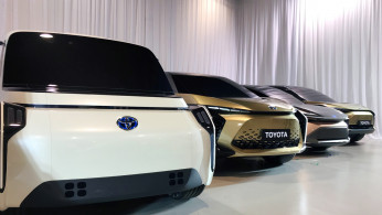 Toyota Motor displays concept versions of its next-generation electric vehicles at a news briefing in Tokyo