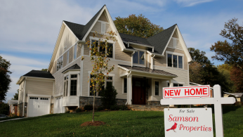 A real estate sign advertising a new home for sale is pictured in Vienna, Virginia