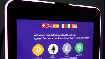 The exchange rates of Bitcoin, Ether, Litecoin and Bitcoin Cash are seen on the display of a cryptocurrency ATM at the headquarters of Swiss Falcon Private Bank in Zurich