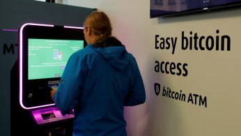 A client uses a cryptocurrency ATM at the headquarters of Swiss Falcon Private Bank in Zurich
