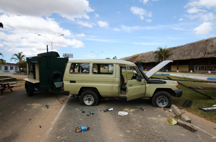 A crashed car is seen at the scene where Venezuelan soldiers opened fire on indigenous people near the border with Brazil on Friday, according to community members, in Kumarakapay