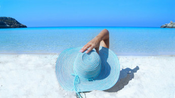 Blue hat in a sunny beautiful summer