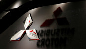Logos of Mitsubishi Motors Corp is seen at a showroom of the company's headquarters in Tokyo