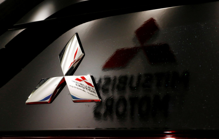 Logos of Mitsubishi Motors Corp is seen at a showroom of the company's headquarters in Tokyo