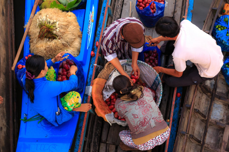 Two Men and Two Women on a Boat With Plastic Bags