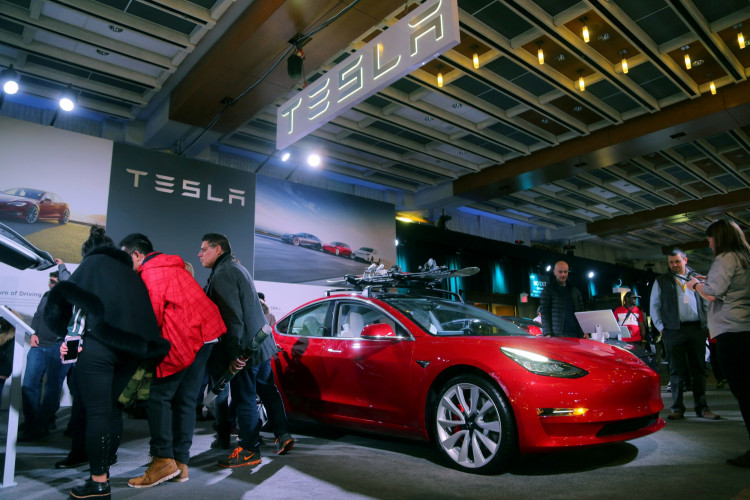 A Tesla Model 3 car is displayed at the Canadian International AutoShow in Toronto