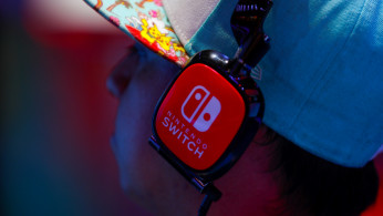 An attendee tests out a new game during the opening day of E3, the annual video games expo revealing the latest in gaming software and hardware in Los Angeles