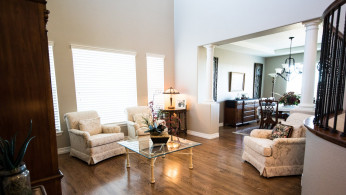 A cozy room featuring beautiful sofa chairs.