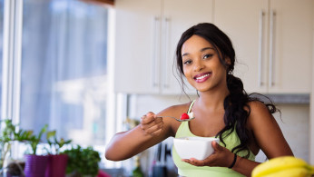 Woman holding a bowl of goodness.