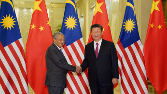Chinese President Xi Jinping shakes hands with Malaysian Prime Minister Mahathir Mohamad before the bilateral meeting of the Second Belt and Road Forum in Beijing