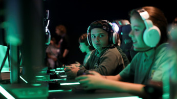 Young gamers play Xbox at Microsoft's new Oxford Circus store ahead of its opening in London