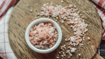 Pink Himalayan salt in a ceramic bowl.