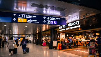 People roaming around airport.