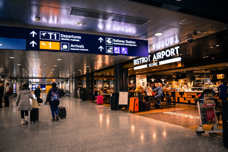 People roaming around airport.
