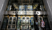 Visitors walk as they leave the Bank Indonesia headquarters in Jakarta