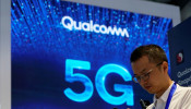 Signs of Qualcomm and 5G are pictured at Mobile World Congress (MWC) in Shanghai