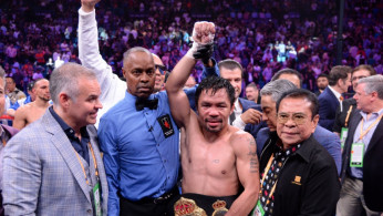 Manny Pacquiao (white trunks) celebrates after defeating Keith Thurman (not pictured) in their WBA welterweight championship bout at MGM Grand Garden Arena