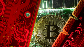A copy of bitcoin standing on PC motherboard is seen in this illustration picture