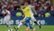 Soccer Football - Copa America Brazil 2019: Philippe Coutinho in action with Peru's Renato Tapia