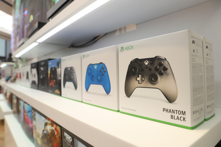 Xbox gaming controllers sit on a display shelf at Microsoft's new Oxford Circus store ahead of its opening in London