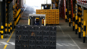 Crates of beer are transported on a folklift from the production line inside the East African Breweries Limited factory in Ruaraka factory