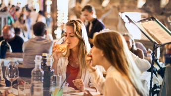 Women enjoying their meal.