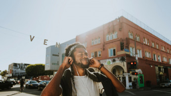 Man smiling while listening to music.