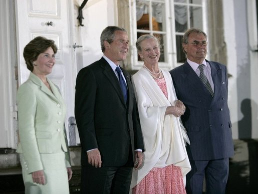 Queen Margrethe II and her husband (the late) Prince Henrik of Denmark welcome President George W. Bush and his wife Bush at Fredensborg Palace, July 5 2005.