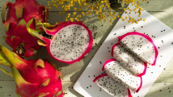 Sliced dragon fruit on plate.