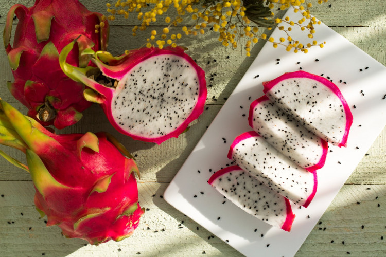 Sliced dragon fruit on plate.