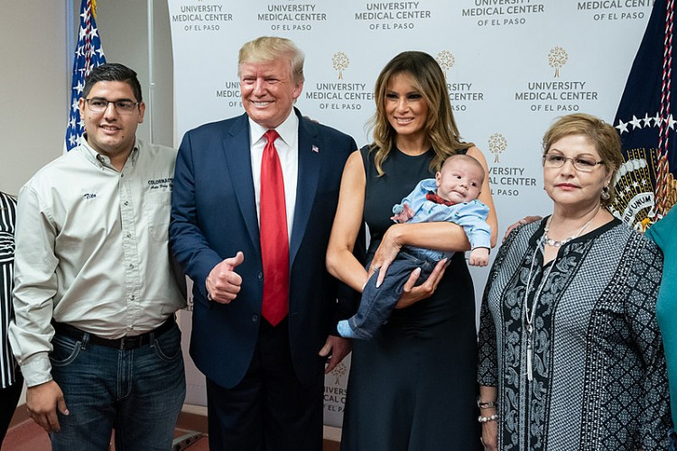 Trump and the first lady with the family and baby son of El Paso shooting victims Jordan and Andre Anchondo.
