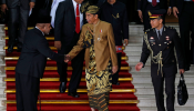 Indonesia's President Joko Widodo greets a parliament member as he departs after delivering address ahead of Independence Day at the parliament building in Jakarta