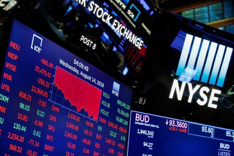 A screen shows the numbers after the closing bell at the New York Stock Exchange (NYSE) in New York