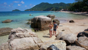 Tourists take pictures on the island of Koh Tao, Thailand