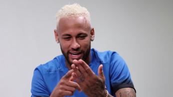 Brazilian soccer player Neymar smiles during an interview with Reuters in Praia Grande