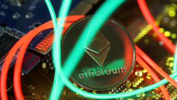Representation of the Ethereum virtual currency standing on the PC motherboard are seen in this illustration picture