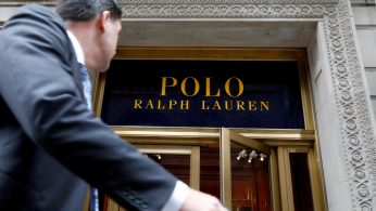A man walks past Ralph Lauren Corp.'s flagship Polo store on Fifth Avenue in New York