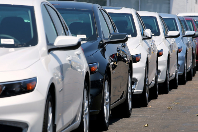 New cars are shown for sale at a Chevrolet dealership in National City, California