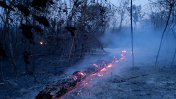 A tract of Amazon jungle burning is seen in Canarana