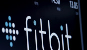 The ticker symbol for Fitbit is displayed at the post where it is traded on the floor of the New York Stock Exchange (NYSE) February 23, 2016. 