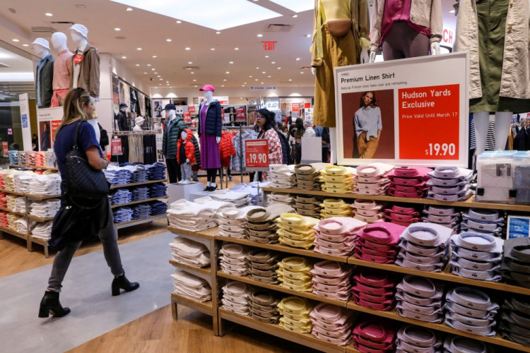 People shop at an H&M store during the grand opening of the The Hudson Yards development in New York