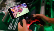 A gamer plays a cloud-based coputer game of Microsoft's Project X Cloud during Europe's leading digital games fair Gamescom