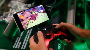 A gamer plays a cloud-based coputer game of Microsoft's Project X Cloud during Europe's leading digital games fair Gamescom