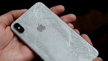 A worker refurbishes an Apple Iphone cell phone at a workshop of the Oxflo company, specialised in refurbishment of broken European smartphones in Lusignac